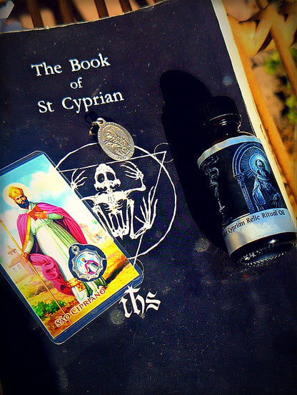 Saint Cyprian feast bundle with Book of Saint Cyprian, medal, card, and oil