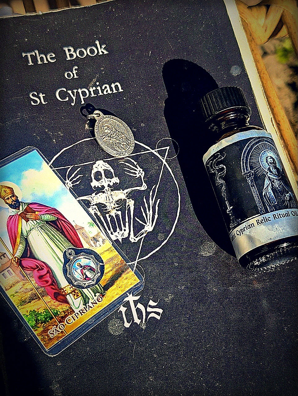Feast Day Bundle: Saints Cyprian and Justina with oil, medal, prayer card, and Book of Saint Cyprian