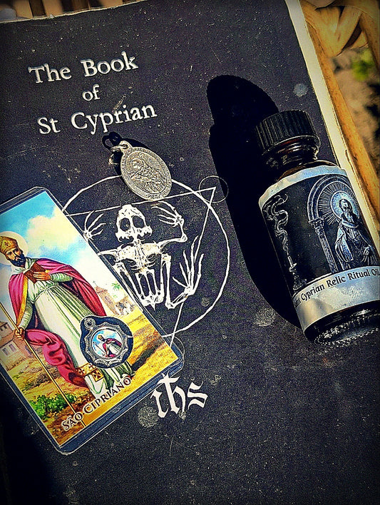 Feast Day Bundle: Saints Cyprian and Justina with oil, medal, prayer card, and Book of Saint Cyprian