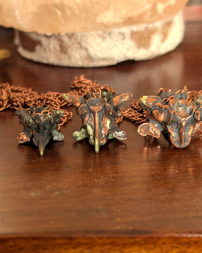 Small, medium, and large python vertebrae pendulums