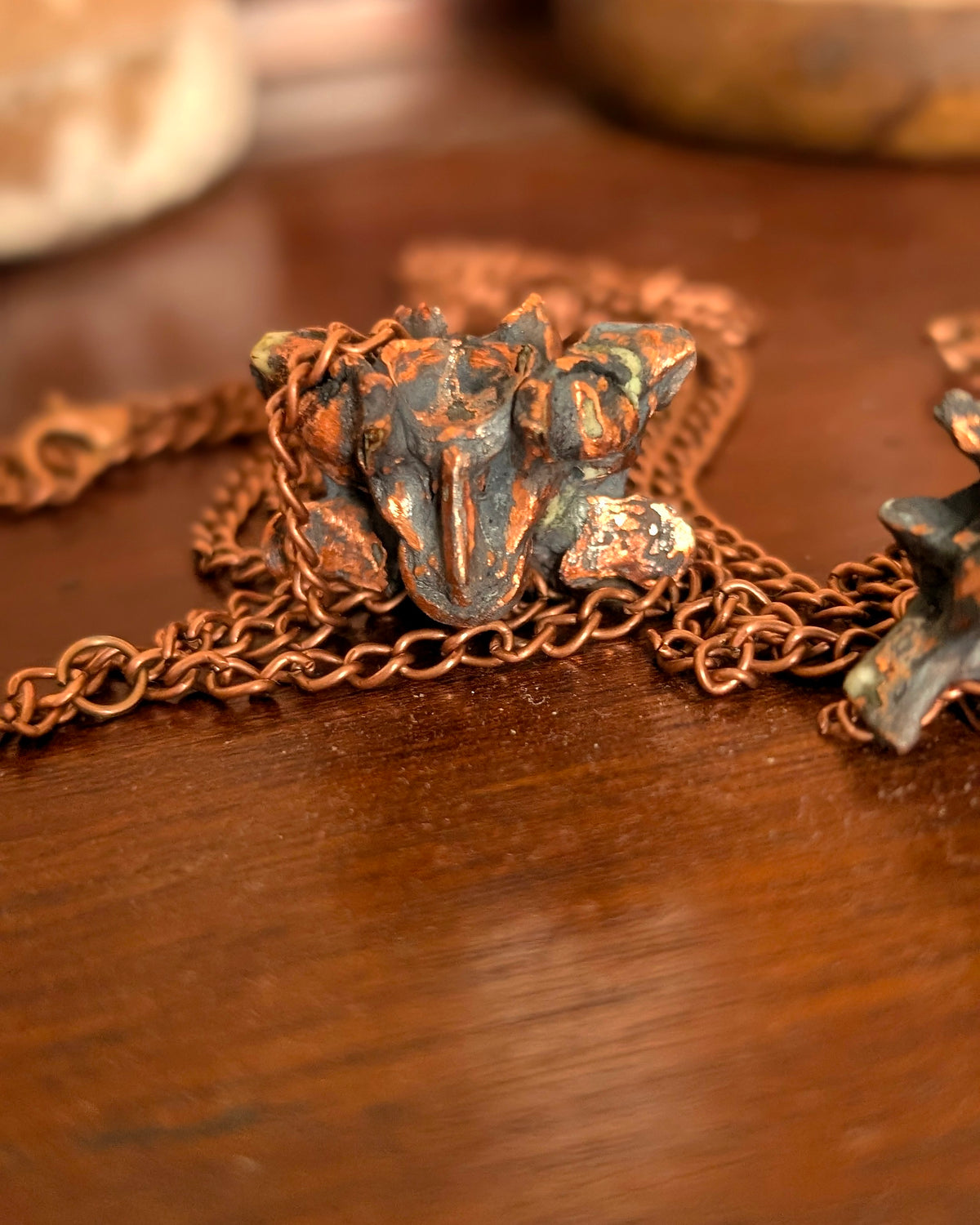 Copper-clad python vertebrae pendulum detail