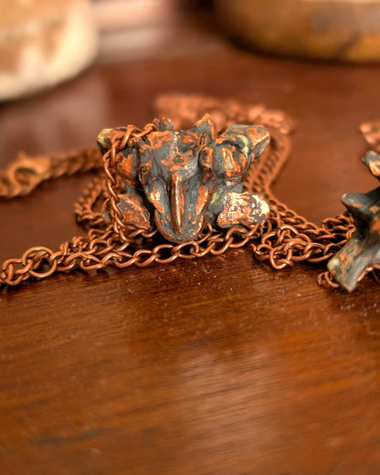 Copper-clad python vertebrae pendulum detail