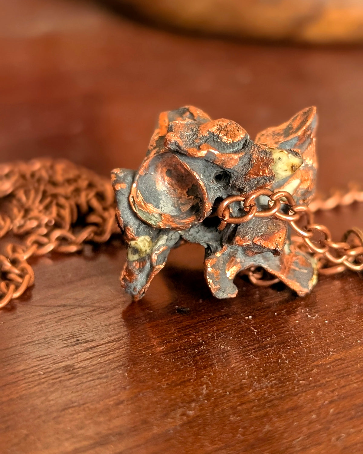 Macro texture of copper-clad python vertebrae pendulums