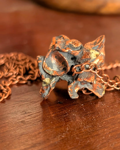 Macro texture of copper-clad python vertebrae pendulums