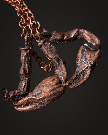 Close view of Venus Scorpio copper charm texture and finish
